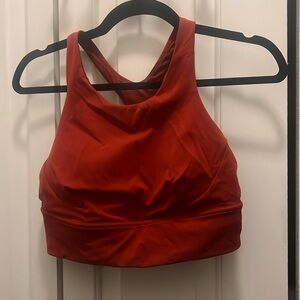 Burgundy colored Lululemon sports bra. High neck